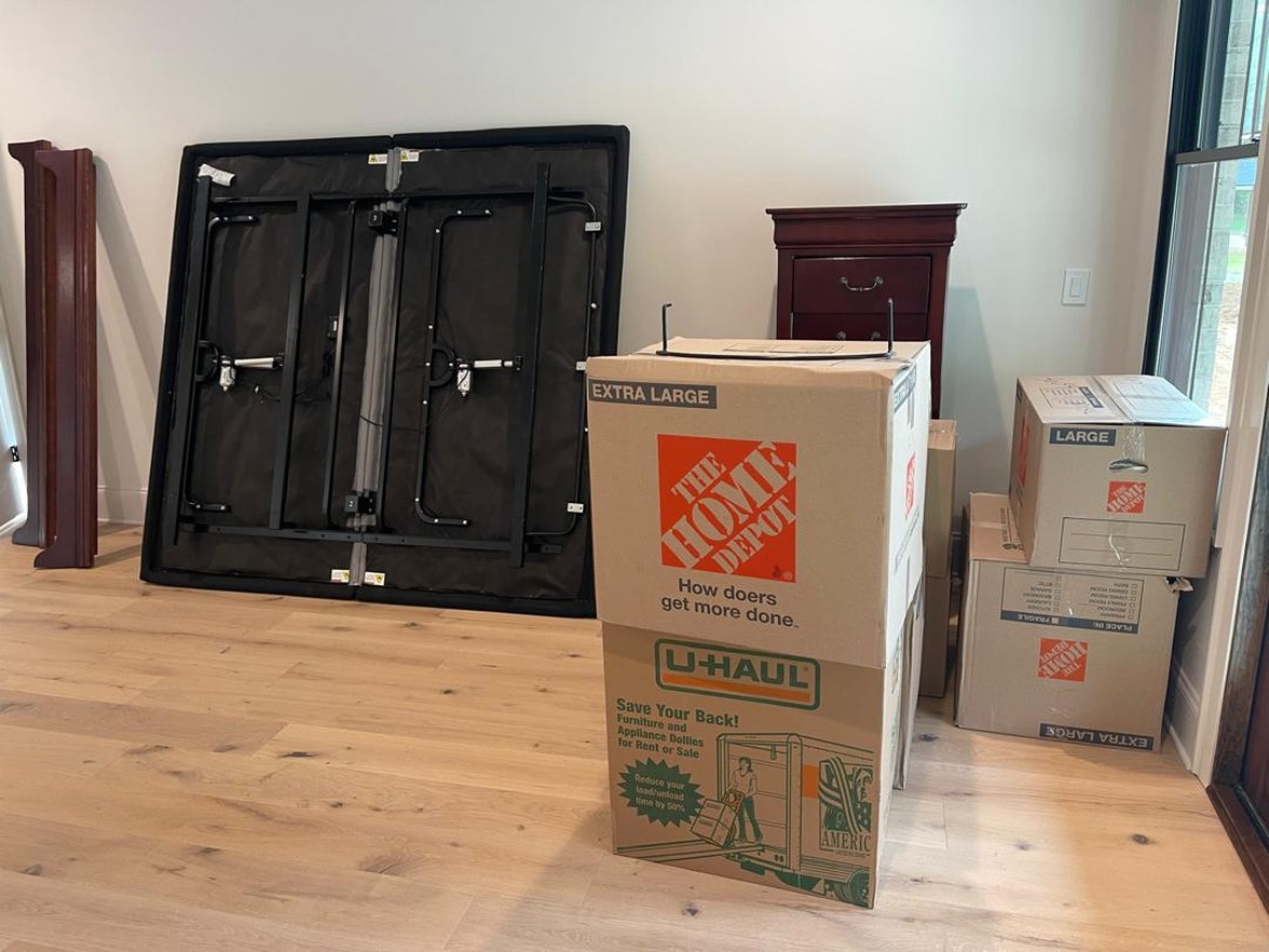 Professional moving labor crew loading boxes and heavy furniture into a rental truck in Murfreesboro