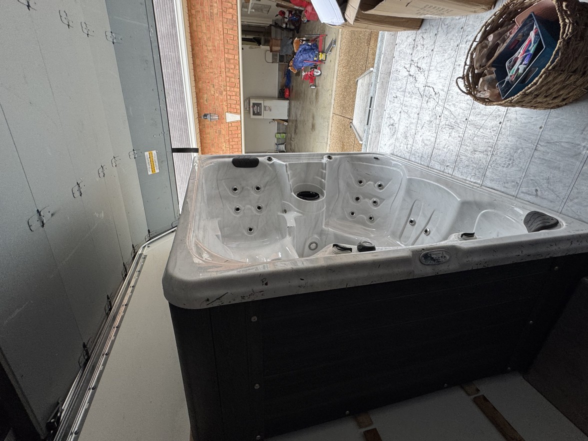 Specialized heavy-lifting movers using a spa dolly to transport and relocate a hot tub in Mount Juliet.