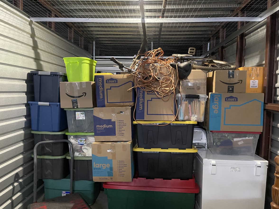 Secure climate-controlled storage facility with neatly stacked furniture and boxes in Franklin.
