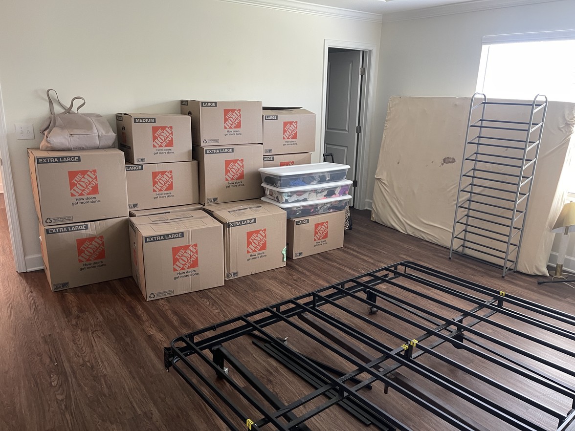 Professional local movers loading household furniture into a truck during a residential move in Nashville, TN