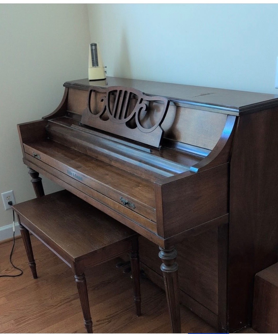 Experienced movers using heavy-duty padding and equipment to safely transport an upright piano in Brentwood, TN.